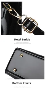 Detail of golden metal buckles and protective bottom rivets on black crocodile embossed bag