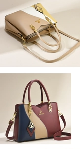 Close-up of color-block leather handbags with butterfly pendant and gold hardware