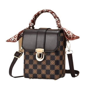 Mini crossbody phone bag with brown checkerboard pattern and silk-wrapped top handle