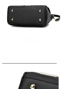 Close-up of black embossed handbag showing durable metal feet and neat leather stitching