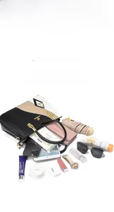Top view of spacious interior of the tricolor tote bag with daily essentials inside