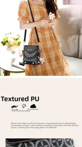 Detail of vintage patterned black PU leather crossbody bag with soft texture and chain