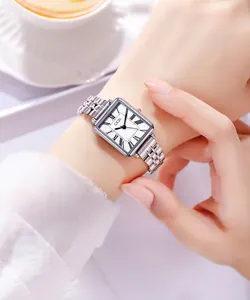 Close-up of elegant silver square watch with Roman numerals on a woman wrist