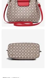 Detailed view of women's floral canvas handbag with red leather trim and metal feet studs