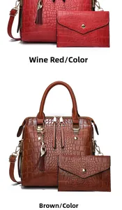 Detail of crocodile pattern tote bag set in wine red and yellow with tassel charm