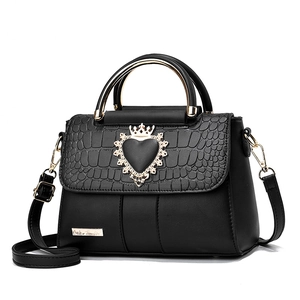 Elegant black embossed faux leather handbag with golden crown heart clasp and metal handle