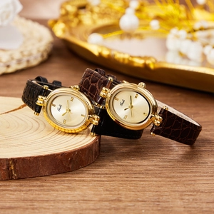 Vintage Gedi women watches with gold oval cases and crocodile texture leather straps
