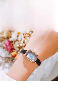 Elegant women's square quartz watch with navy sunray dial and black leather strap