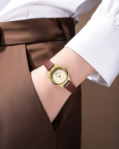 Detail of Gedi vintage quartz watch with gold tonneau case and brown lizard leather strap