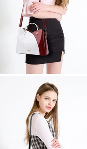 Détail de la texture crocodile et du logo ZZMY doré sur le sac à main de luxe
