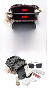 Detail view of the multi-compartment interior and capacity of this mini crossbody phone bag