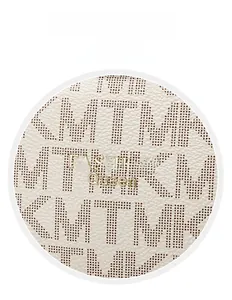 Detail of white lychee leather with TMK print and golden Fashion Queen logo plaque