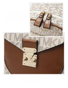 Close-up of golden push-lock and dual zipper detail on monogram backpack