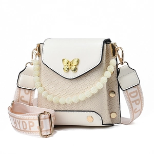 Mini cream crossbody phone bag with pearl handle and golden butterfly buckle decor