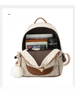 Detail view of large capacity interior for laptops and bottles in a stylish backpack