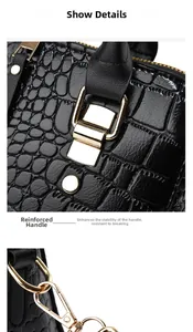 Close-up of black crocodile embossed handbag with premium gold metal swivel hooks and hardware