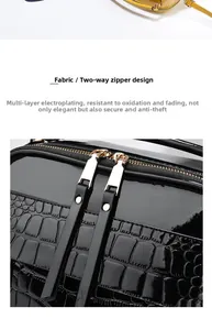 Détail du sac en cuir verni noir à texture crocodile avec fermetures dorées