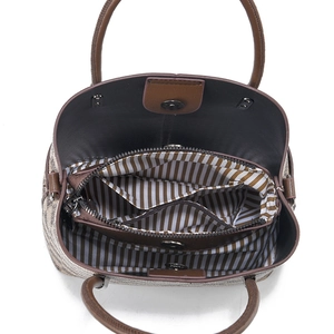 Spacious bucket bag with striped lining and multiple interior storage compartments