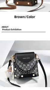 Close-up of printed monogram crossbody bag with black leather flap and cute charm