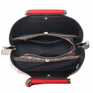 Women's vintage chain-patterned handbag with red handles and triple-compartment interior
