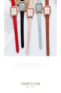 Flat lay of colorful women square quartz watches with leather straps and rose gold cases