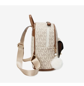 Side view of beige monogram backpack with brown leather trim and fluffy pompom charm