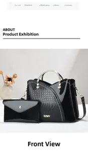 Détail du sac à main en cuir crocodile avec poignée dorée et logo sur le devant