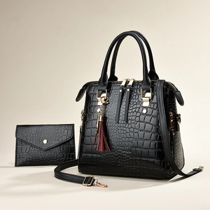 Elegant black crocodile-textured tote bag set with tassel and gold-tone metal hardware
