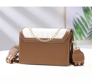 Detail view showing the premium white stitching and brown leather finish on the bag back