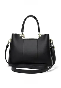 Close-up of classic black pebble leather texture with elegant gold hardware accents