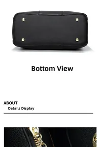 Close-up of black lychee leather tote bag bottom with gold studs and smooth metal zipper