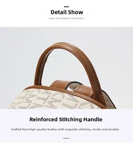 Detail of reinforced top handle with brown leatherette and M-letter monogram pattern