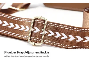 Detail of woven bag strap with white arrow embroidery and adjustable gold metal buckle