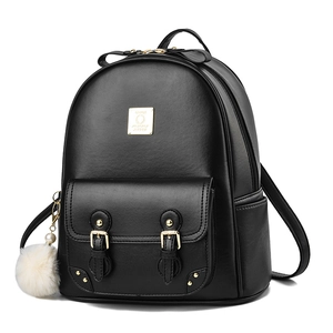 Fashionable black faux leather backpack for women with gold buckles and a white fur charm