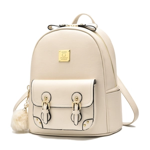 Chic beige leather backpack for women with golden hardware, bow detail, and plush charm