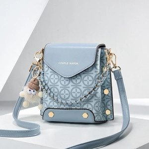Fashionable light blue PU leather handbag with floral pattern and metallic chain strap