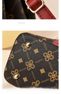 Détails du fermoir doré et des rivets de protection sur le sac à main en cuir