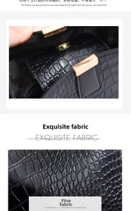 Detail of black crocodile texture leather and magnetic gold hardware clasp on bucket bag