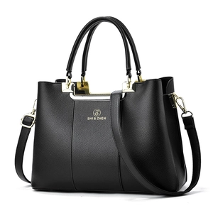 Classic black litchi texture tote bag with gold hardware and adjustable strap for women