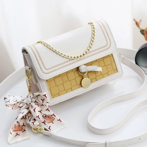 Chic white and yellow color-block crossbody bag with embroidery and metal chain strap
