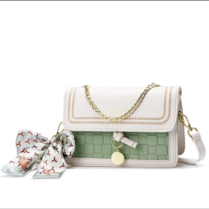 Chic green checkered shoulder bag with white flap, silk scarf and gold chain strap