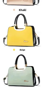 Close-up of glossy patent leather texture and gold hardware on large tote bags