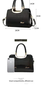Glossy black handbag dimensions showing 28cm length and 19cm height with gold hardware