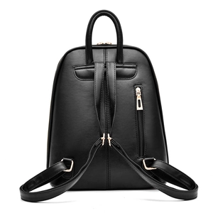 Minimalist black faux leather backpack featuring adjustable straps and gold-tone zippers