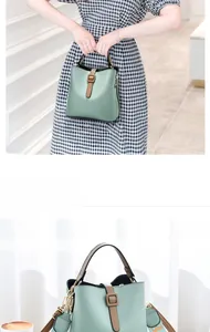 Détail du sac seau vert menthe avec bandoulière large à motifs et boucle métal