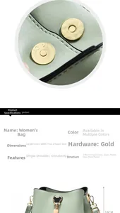 Detail view of light green bucket bag showing dimensions 23x11x18cm and gold hardware