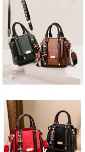 Detail showing faux leather texture, golden metal accents, and a cute bear charm on hand bags