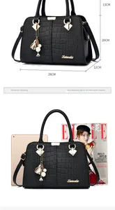 Detailed size chart of black crocodile pattern handbag with iPad and magazine comparison