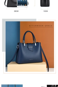 Detail view of navy blue handbag with dimensions 28cm width and 13cm depth shown