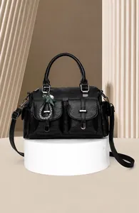 Large capacity black soft leather handbag with front pockets and elegant charm detail